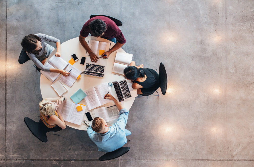 A top down image of university students studying together.