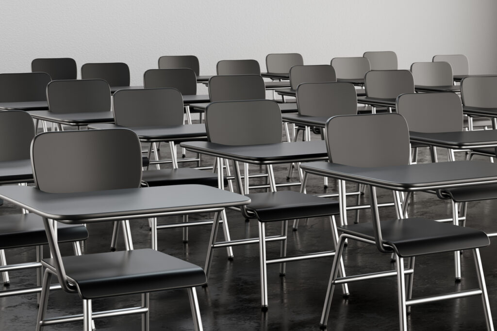 Empty desk seats in lecture room or school classroom. Business seminar, training and education concept. 3D illustration